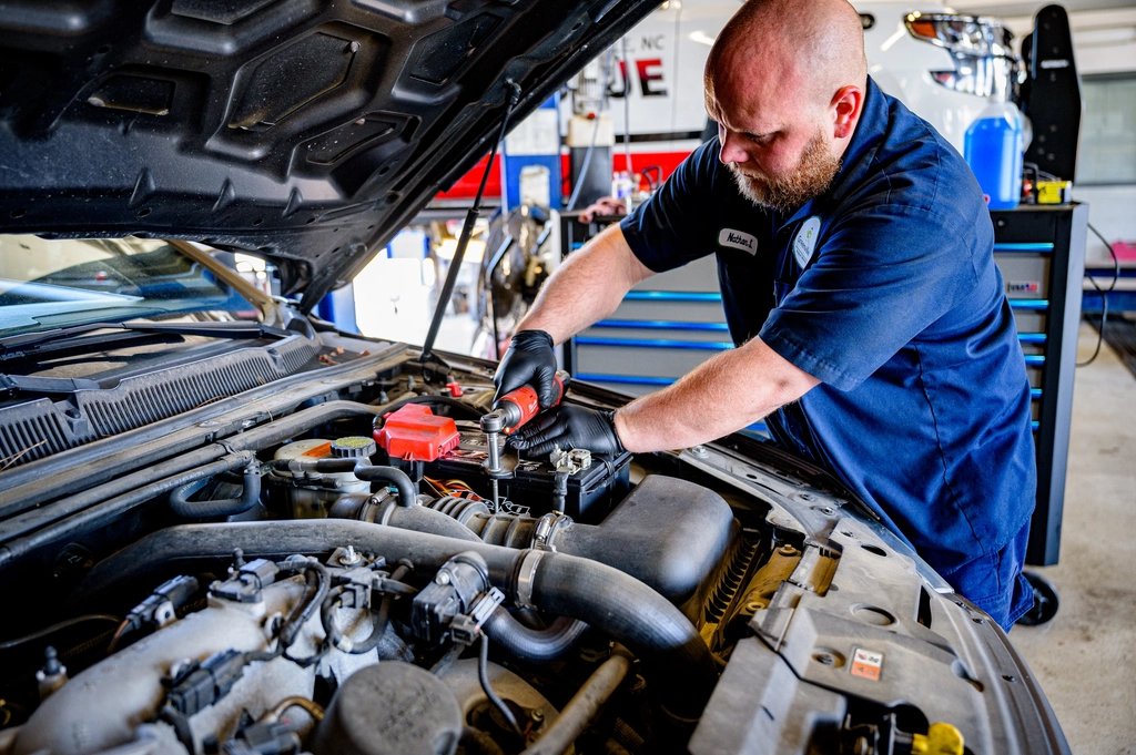 Technician servicing an engine